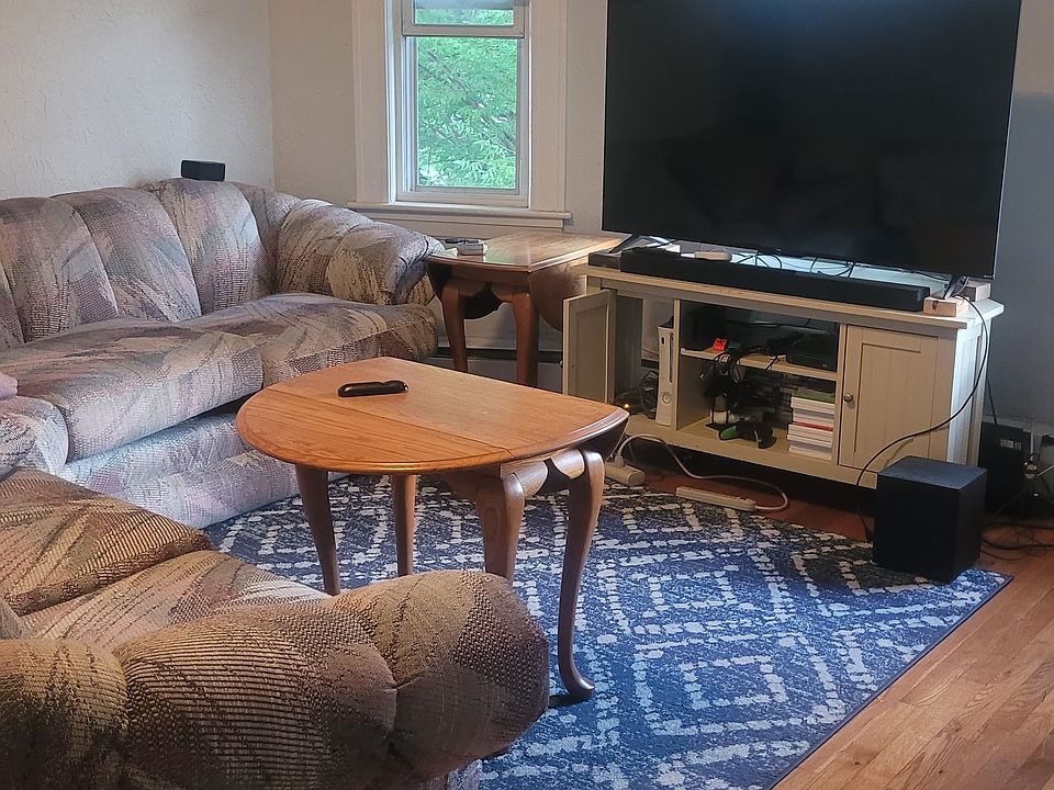 Big living room with hardwood floors and tons of light