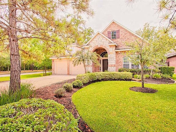Beautiful corner lot at 51 N Crescendo Path Place is ready to move in today!  Brick home on patio lot, two decked patios, screened back yard. David Weekley home is full of possibilities for you.