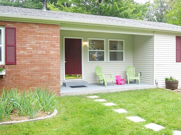 The covered front porch area invites you to rest and relax.