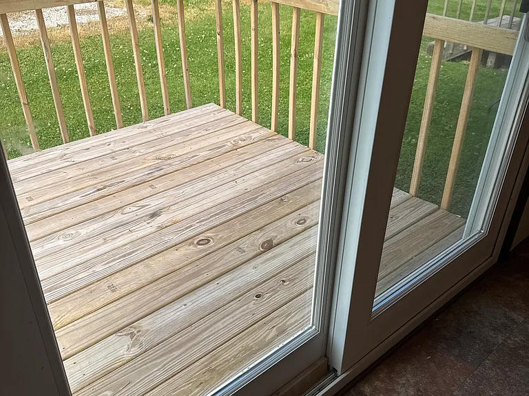 New deck off the kitchen via sldiing doors