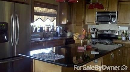 New ktichen; many amenities
						:
						Granite, crowned molding tiled back splash; built in wine cooler.