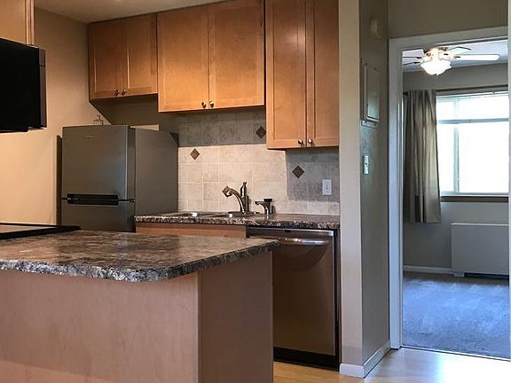 Kitchen + bedroom in background