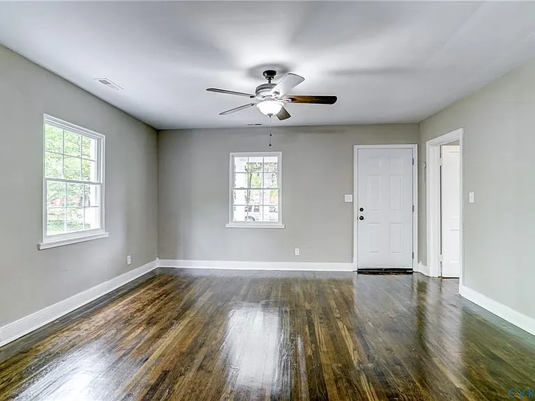 Another view of the spacious living room w/ C-fan!