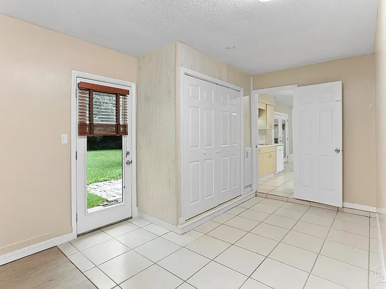 Backyard door, Laundry closet, Door to the Kitchen