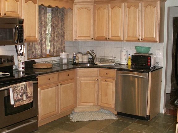 maple cabinets, slate floors