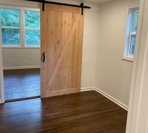 Office with barn door into laundry room