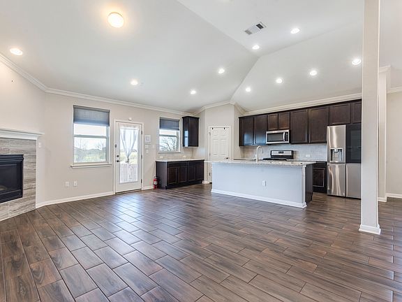 Kitchen open to family room with fireplace