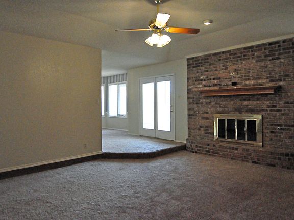 Living area with brick fireplace