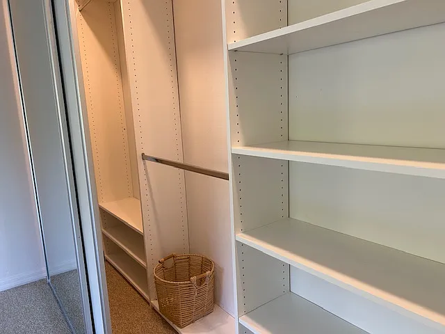 Wall-to-wall fully adjustable custom closets in master bedroom.