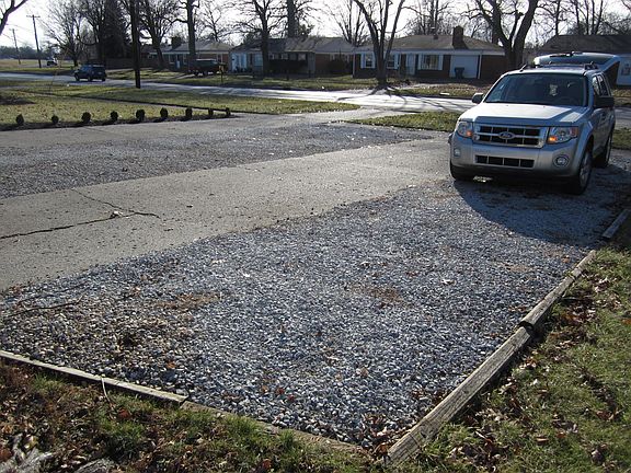 Side and driveway parking with space to turn around.