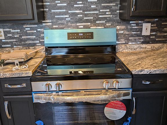 Electric stove with exhaust fan