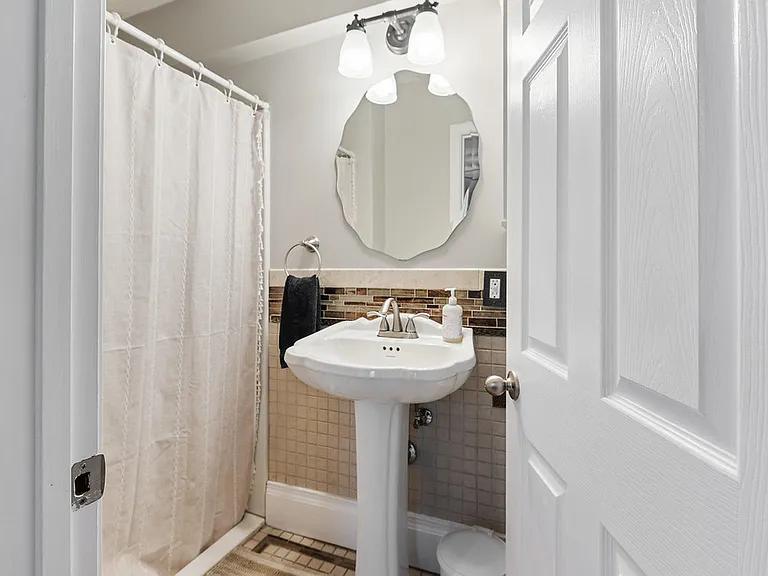Bathroom on the main level has a step in shower