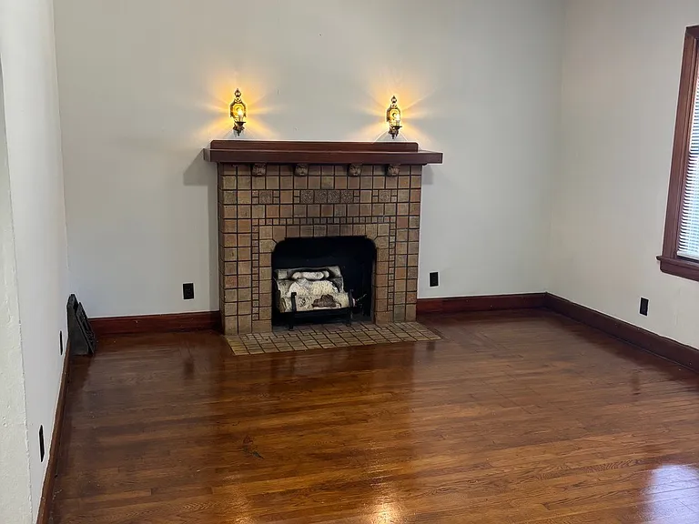 Living room with ornate fireplace (not functional) decorative only