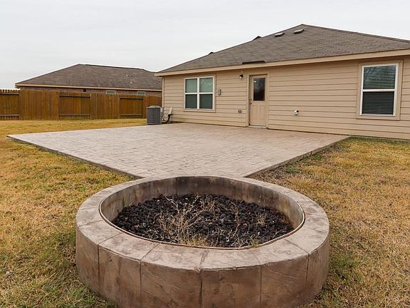 24x24 Stamped Concrete Patio and 5x5 Fire Pit perfect for outdoor entertaining!