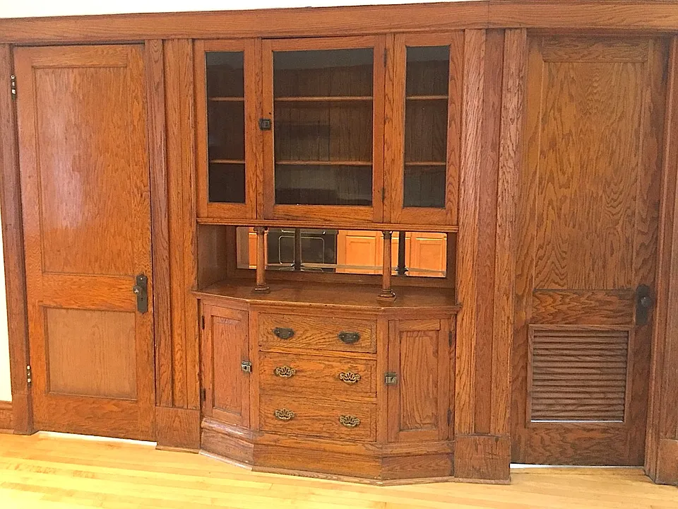 The built-in hutch in the kitchen is a highlight of the vintage woodwork.