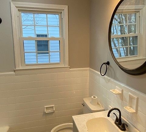 Bathroom with all new commode, vanity, lights, mirror, plubming fixtures