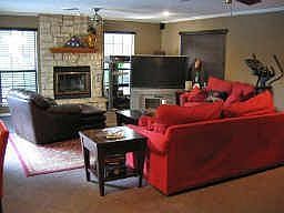 The den has lots of space for furniture and entertainment equipment and views to the pool, spa and g