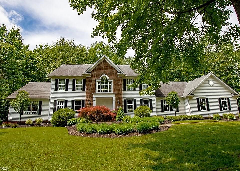 Welcome to 9046 White Oak Rd, a 4 bedroom 3.5 bath colonial custom built by Kern Builders situated on a lovely wooded 2.31 acre lot in The Sanctuary.