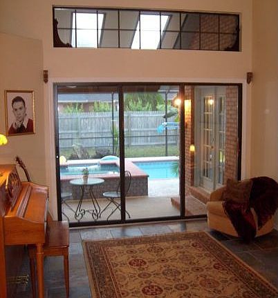 Living area features wide-open access to lanai/spa