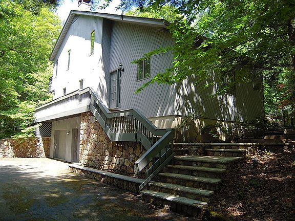 View of side and 2-car garage