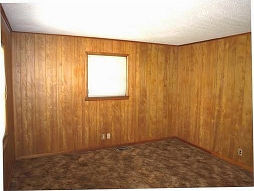 Living area. Hardwood floors under carpet.