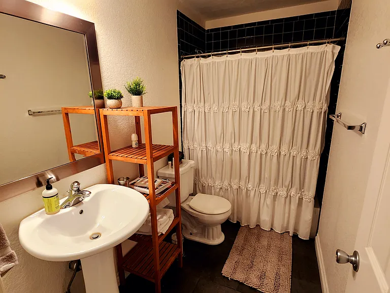 Downstairs full bathroom with tub and shower