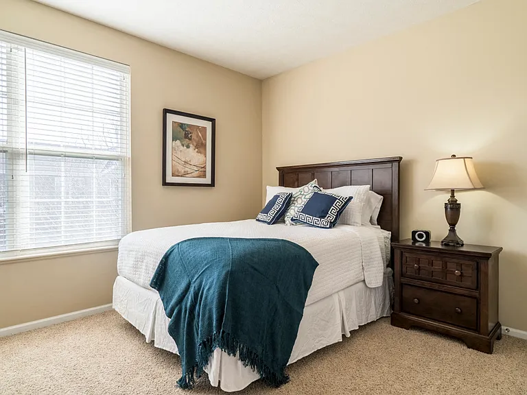 This spacious bedroom is the perfect place to relax, recharge, and make your own.