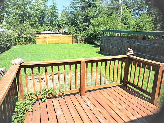 Back yard is spacious, with deck.