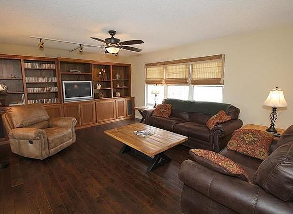 Beautiful family room with built-ins and wood floors.