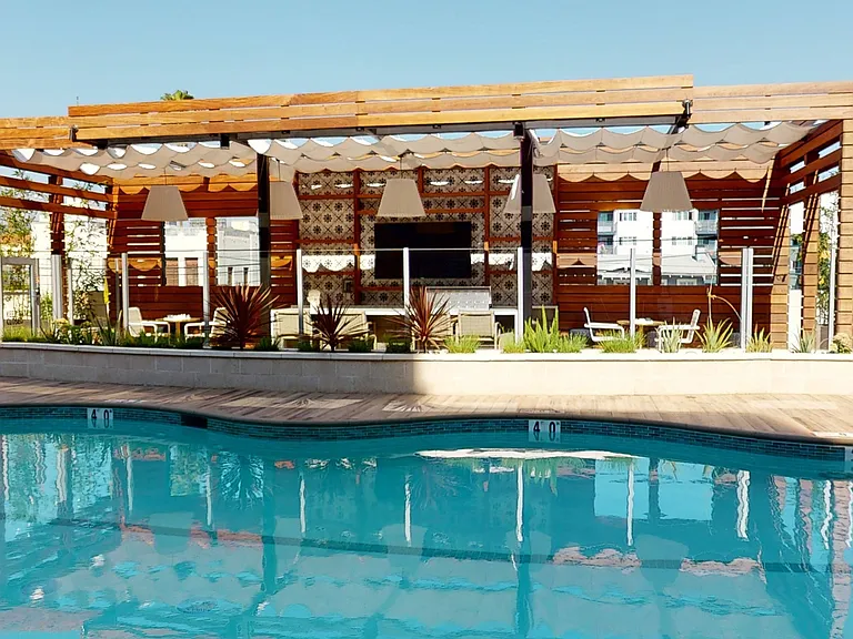 Vacation mode with this poolside kitchen and bar