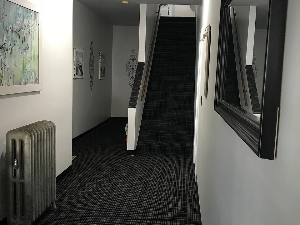 The common area, with apartment two on the left.