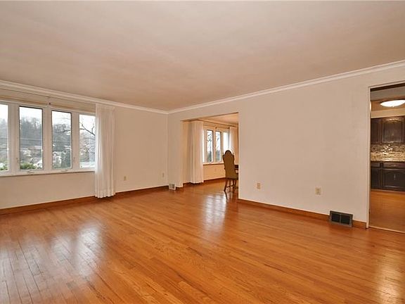 The living room opens to the kitchen and dining room.