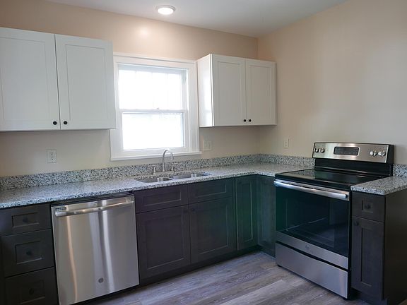 All new kitchen with custom cabinets, granite countertops, and stainless steel appliances