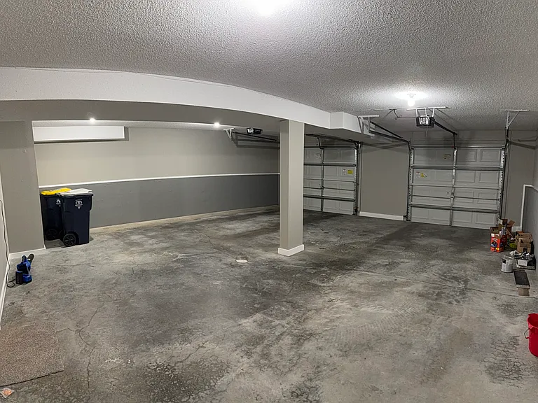 Large 26 x 27 oversize garage with door openers and outside keypad.