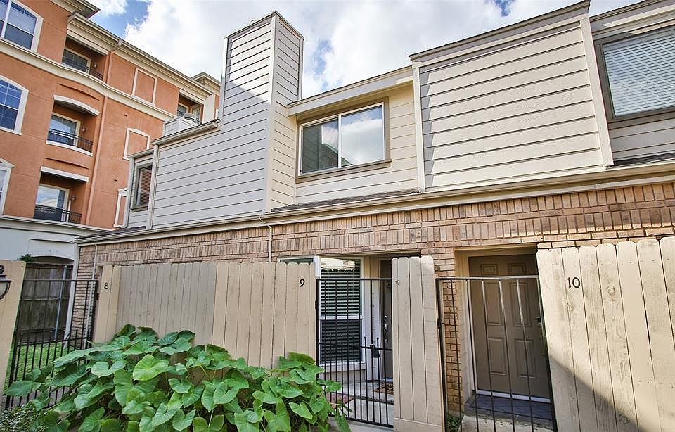 Exterior view of Unit 9, with iron gate into entry.
