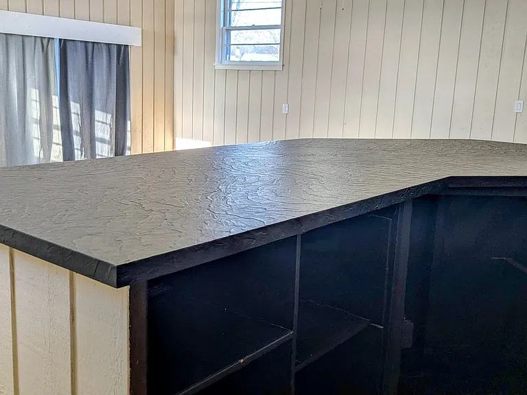 The bar has plenty space for a mini fridge to be installed.