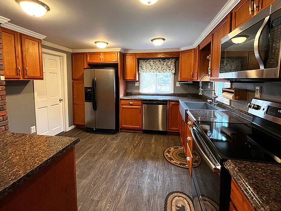 Updated kitchen with stainless steel appliances, lots of counter and cabinet space.