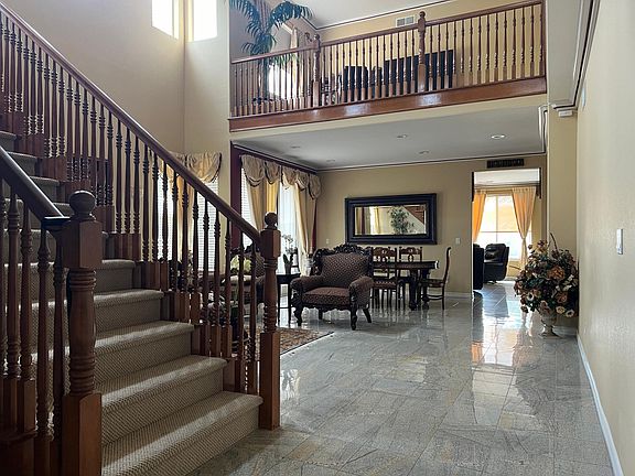 Stairs leading to upstairs and view of the upstairs loft Office/Workspace