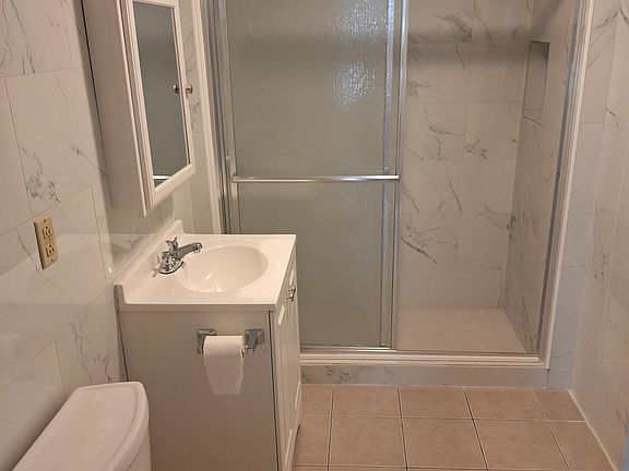 Newly renovated bathroom & walk-in shower.