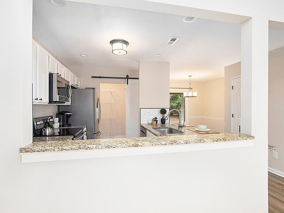 View of kitchen and entrance to pantry/laundry from Living Room