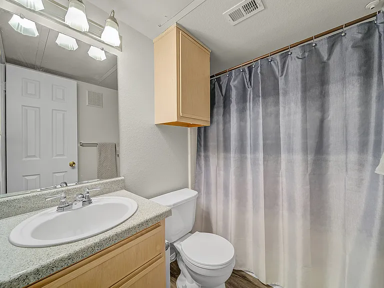 Elevate your daily routine in our classic apartment bathroom