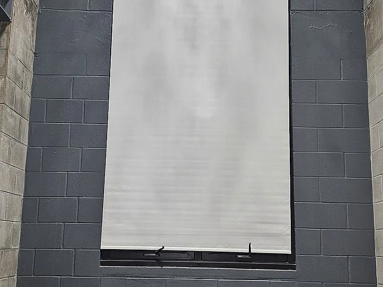 Remote activated electronic shade opens and closes with the touch of a button.