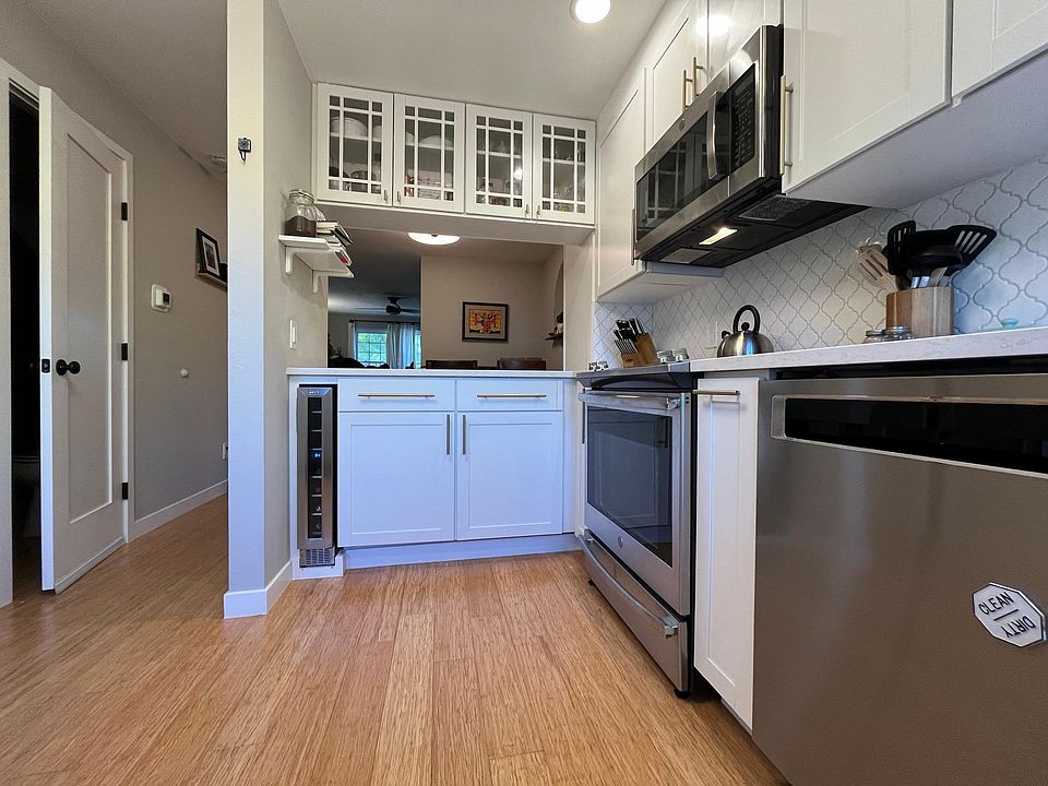 All new stainless steel appliances including 7-bottle wine fridge and whisper-quiet Kitchenaid dishwasher.