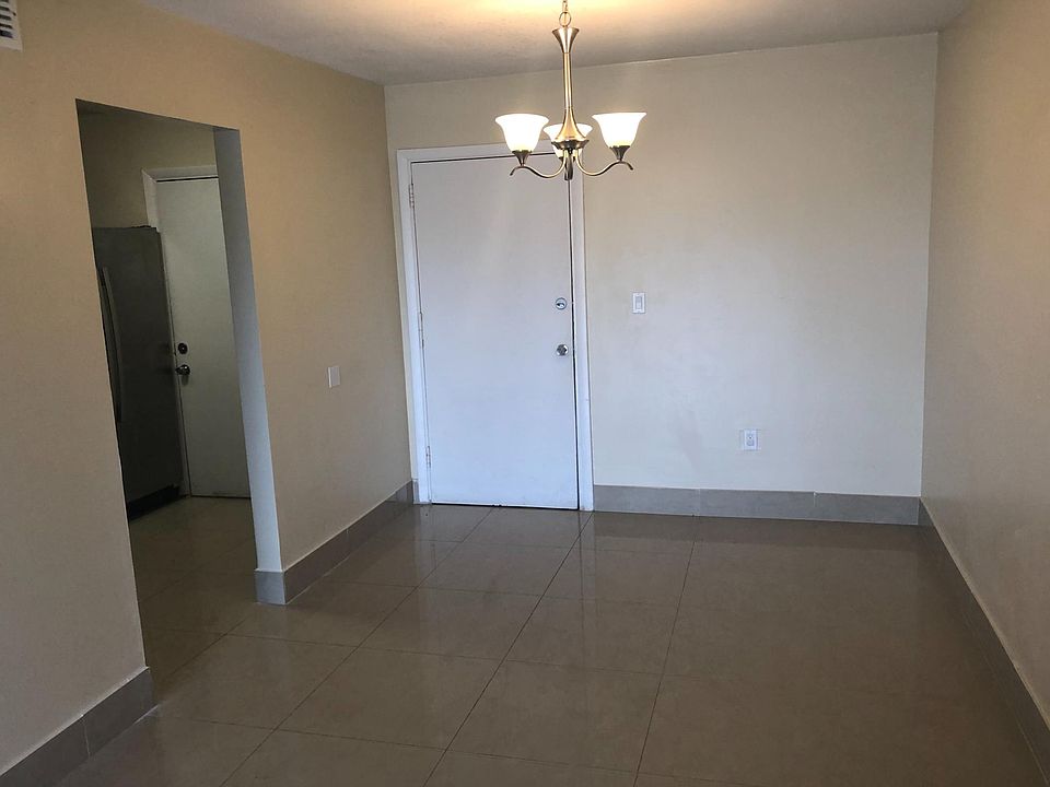 Front Door/Dining Room area with kitchen entrance to the left