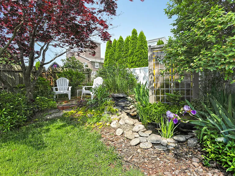 Peaceful retreat in the yard. This raised patio area is perfect for morning coffee or just reading a book. Views of the water pond.