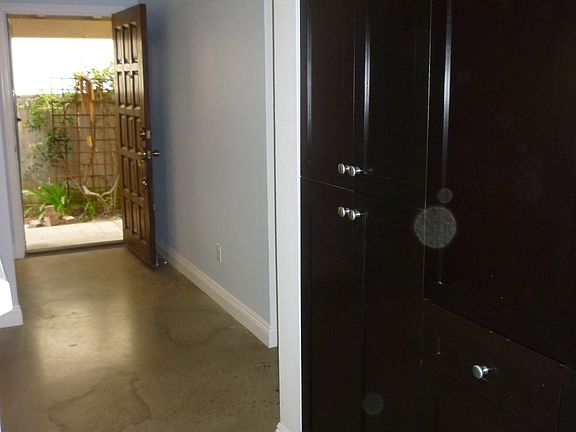 View of front entry and built-in cabinets