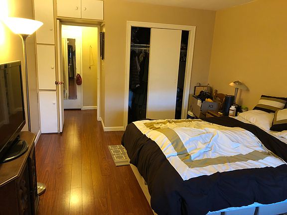 Bedroom with many closets