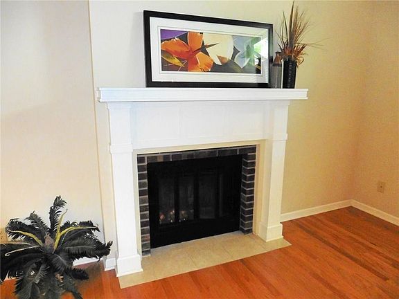 Enjoy winter nights reading by the fire.  With the white traditional mantel, the fireplace is a wonderful focal point.