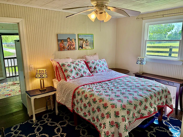 One bedroom, headboard walls and tin ceiling. Beautiful views from every window.