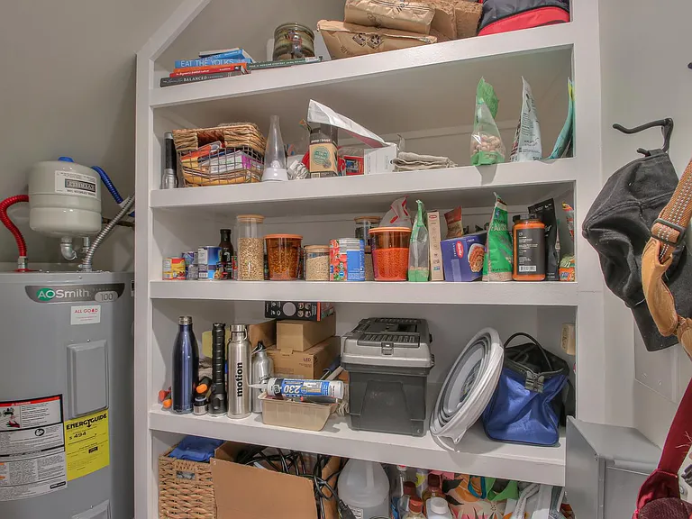 large pantry with custom built-in shelving